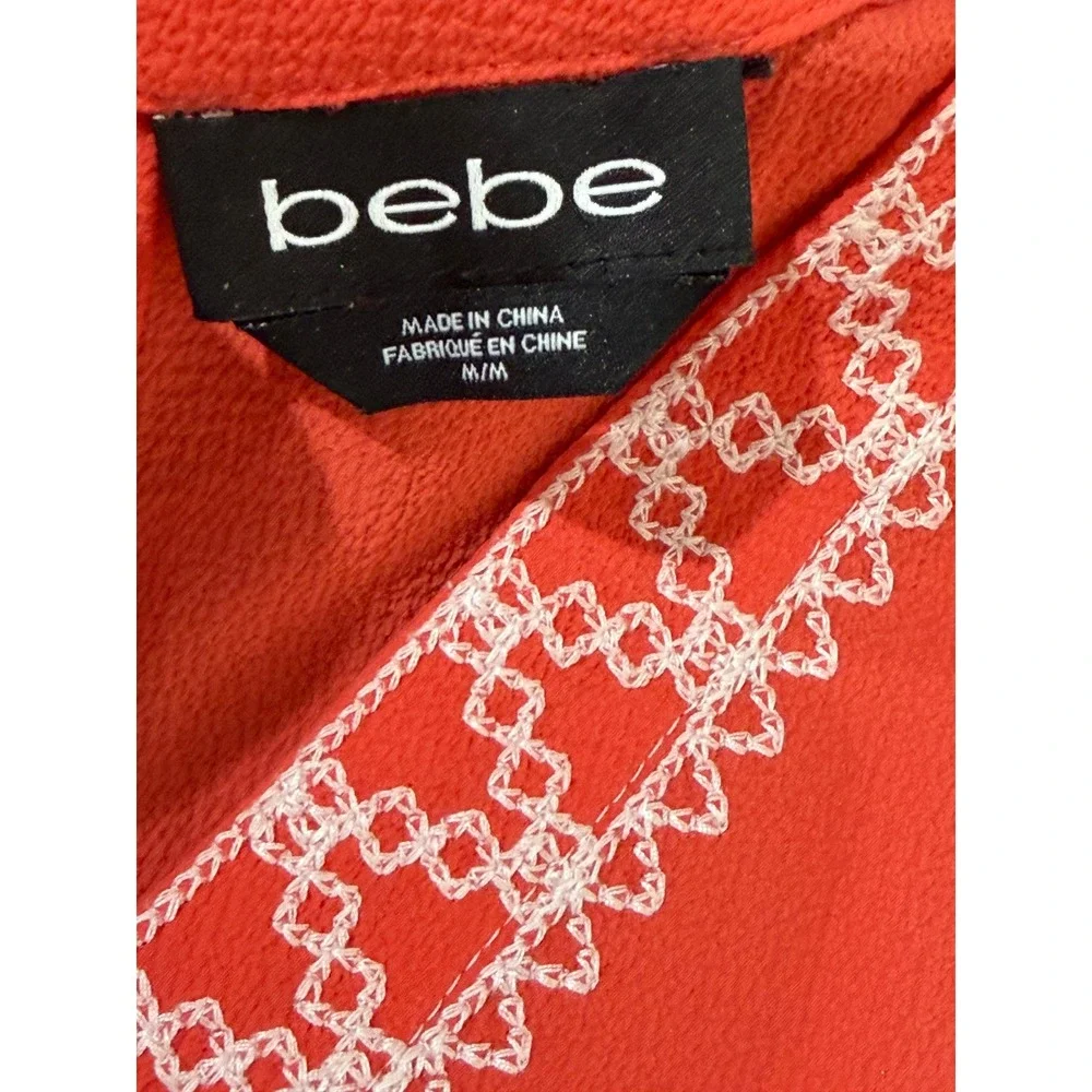 Bebe Womens Coral Orange Embroidered V-Neck Lace Up Back Tassel Blouse Size M